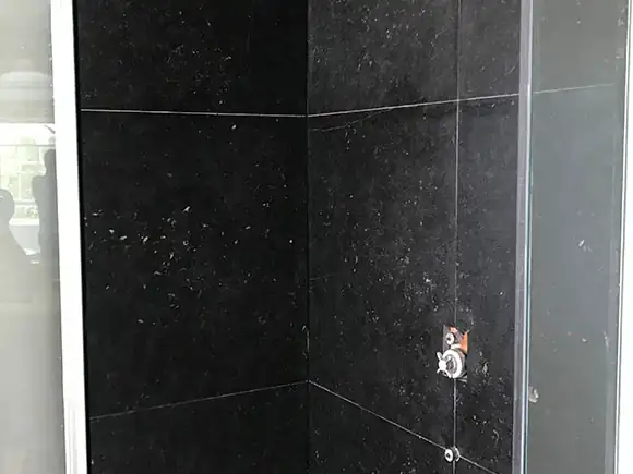 Dark limestone walls from the project gallery